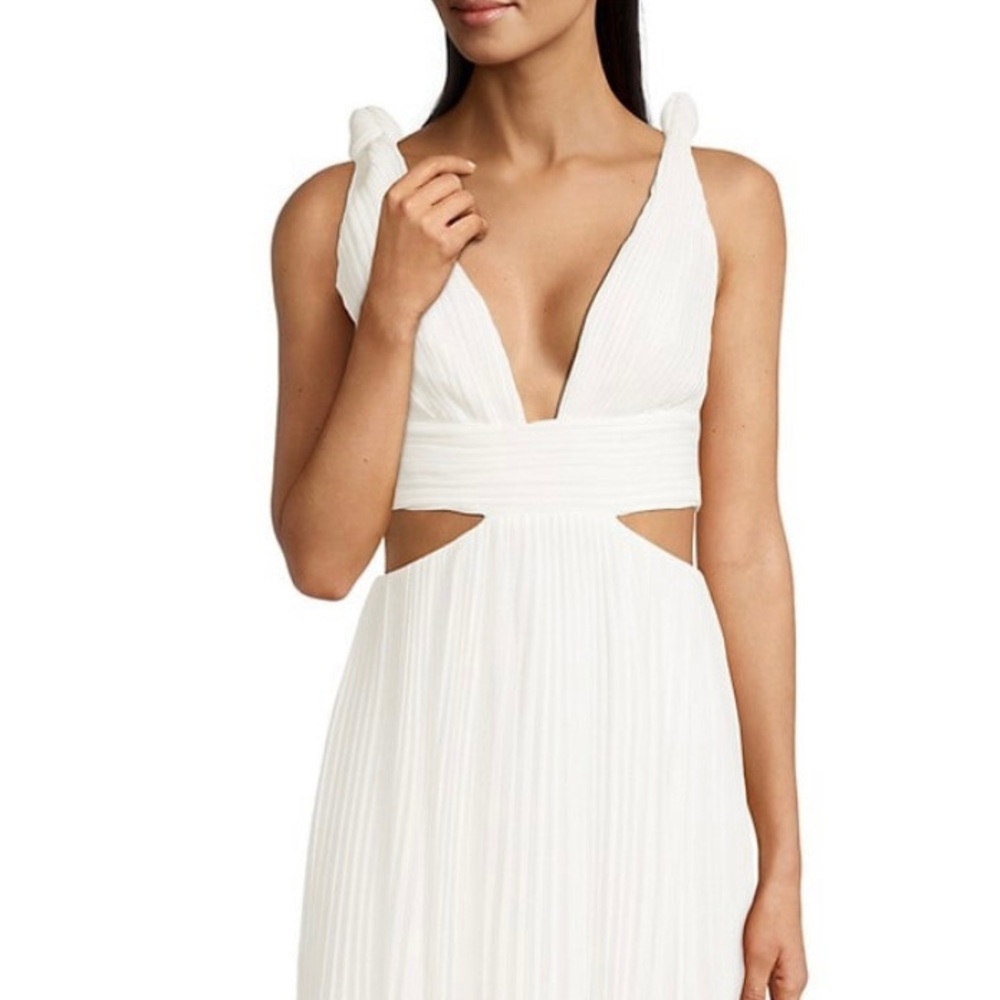 Brand new, never worn with tags still attached beautiful long white maxi dress.